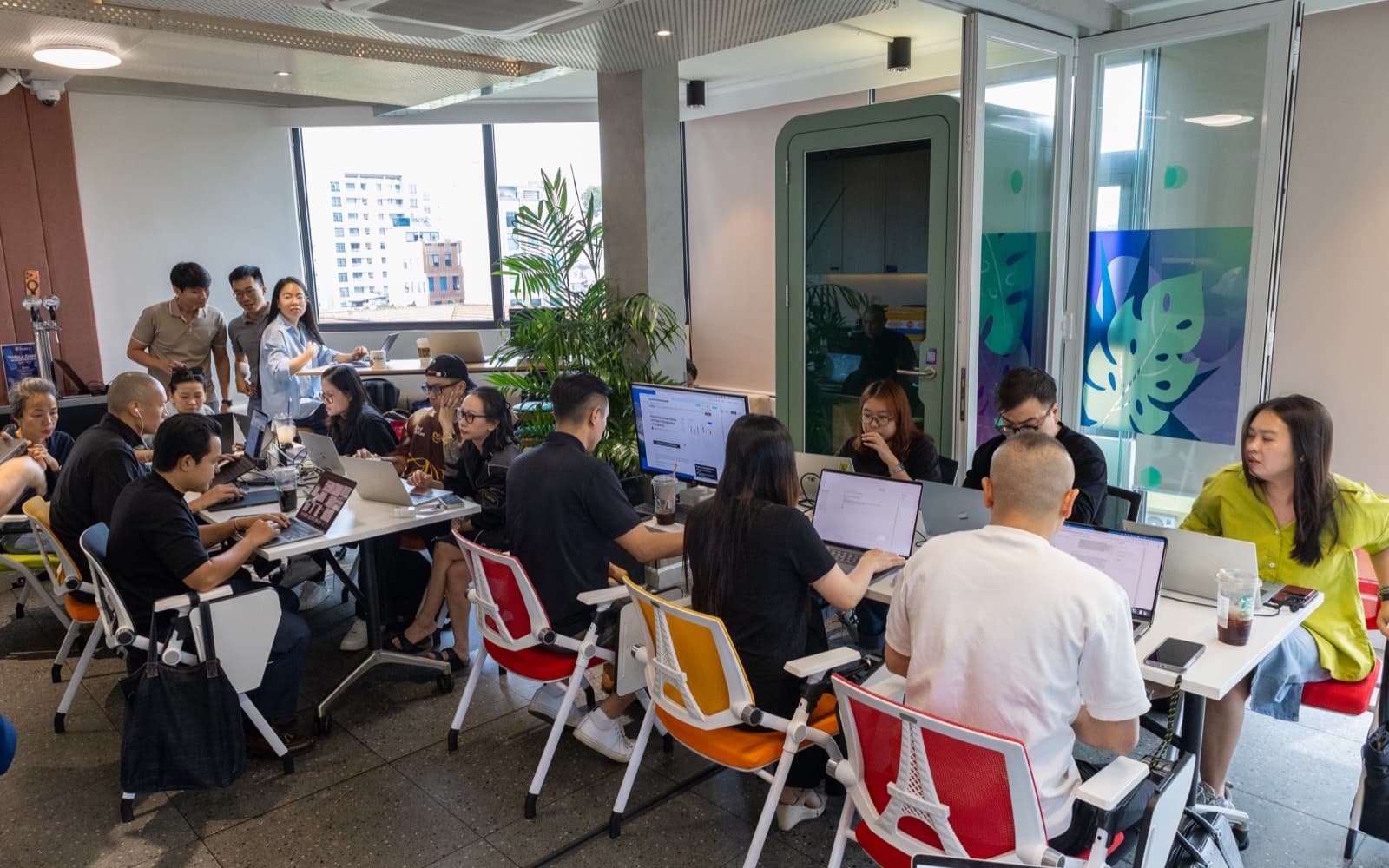 Dru's team building with AI at a workshop in Vietnam